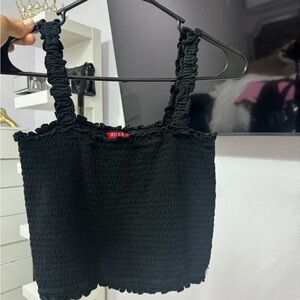 This is a cute top from Guess,it is a size small,the color is a super cute black